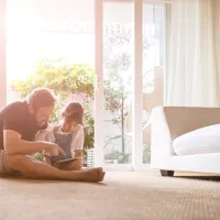 dad and daughter playing on floor